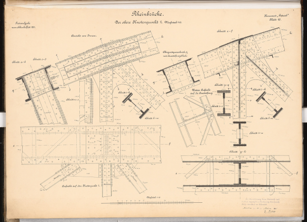 Open book displaying detailed plans and text alongside a drawing of a table.