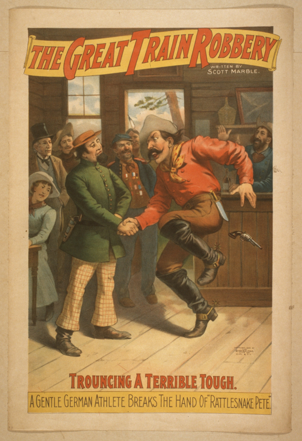 Eine Gruppe von Menschen, die drinnen stehen, einer hält eine Waffe, mit Text oben und unten: "Der große Zugraub - Trouching a Terrible Tough".