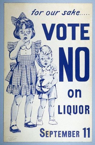 Poster on a wall with two children standing side by side, one holding a ball, reading "Vote No on Liquor" in bold black text.