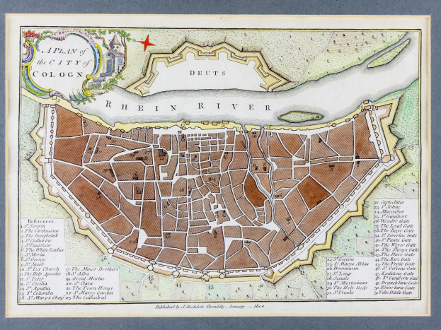 Ein gerahmtes Stadtplan von Köln, Deutschland, mit dem Rhein im Hintergrund.