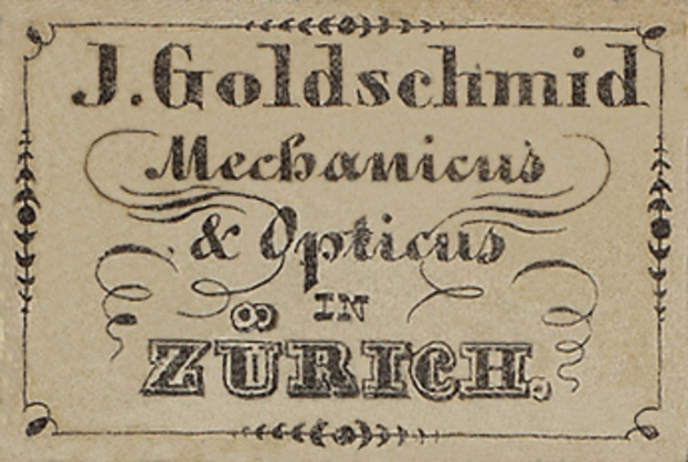 Old business card for "J. Goldschmidt Mechanicus & Optics in Zurich," likely from the early 20th century, listing the company's services.