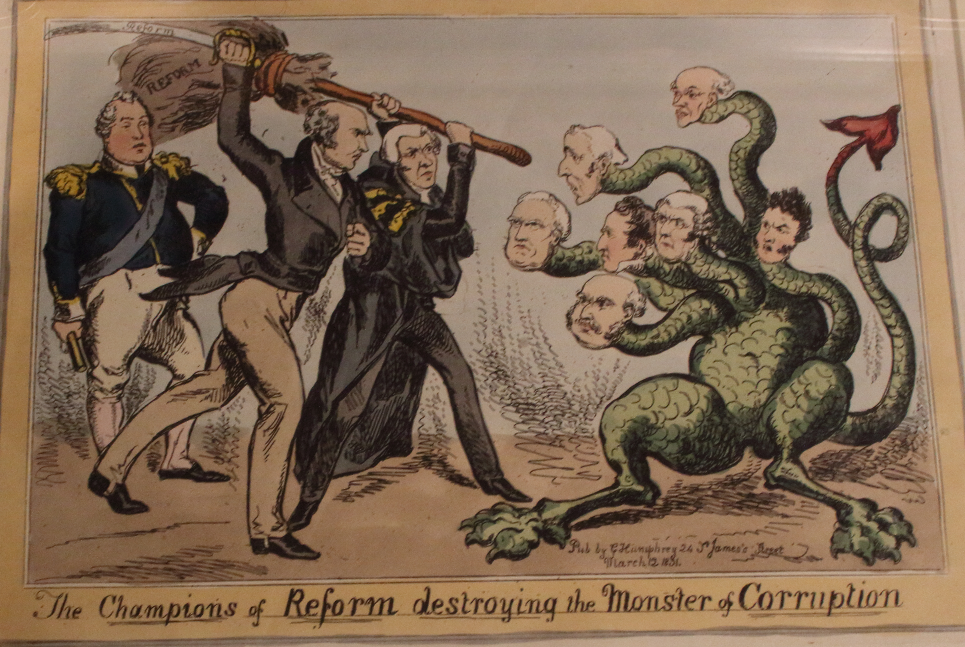 Eine Karikatur auf einem Blatt Papier, die Reformchampions bei der Niederlage eines Monsters namens "Korruption" zeigt, mit dem Text "Die Reformchampions zerstören das Monster der Korruption."