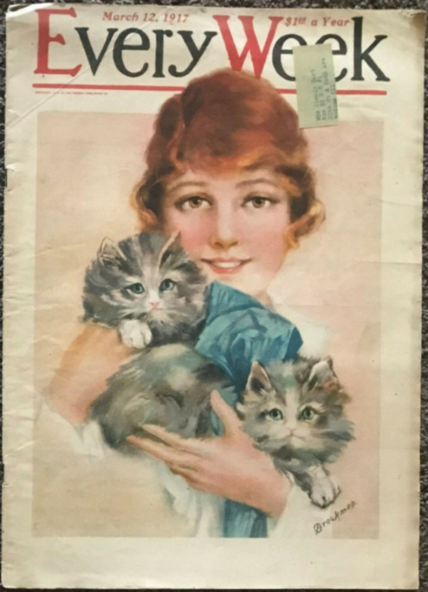 Woman smiling while holding two kittens, with the cover of Every Week magazine visible in the background.